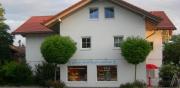 Neubau eines Mehrfamilienhauses mit einer Haushälfte und 3 Wohnungen